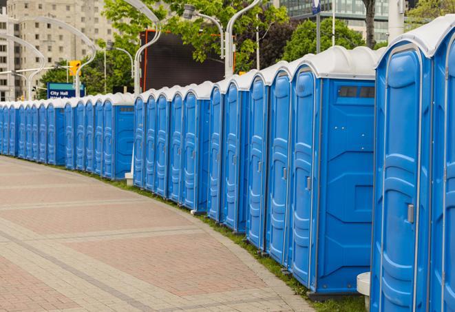 a line of portable restrooms at an outdoor wedding, catering to guests with style and comfort in Belmont, CA